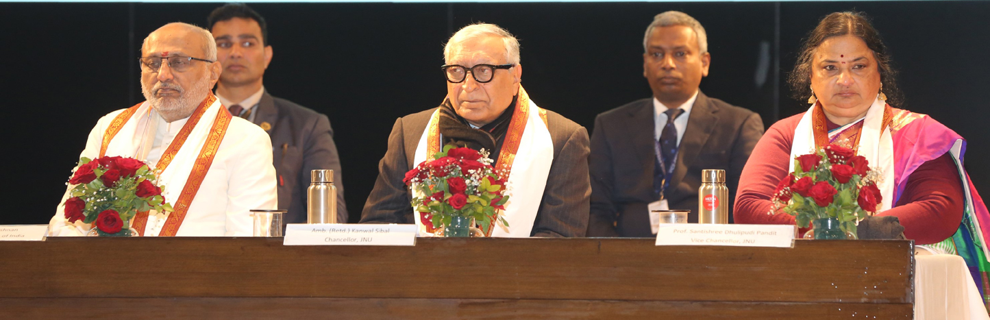 View of convocation stage with dignitaries seated